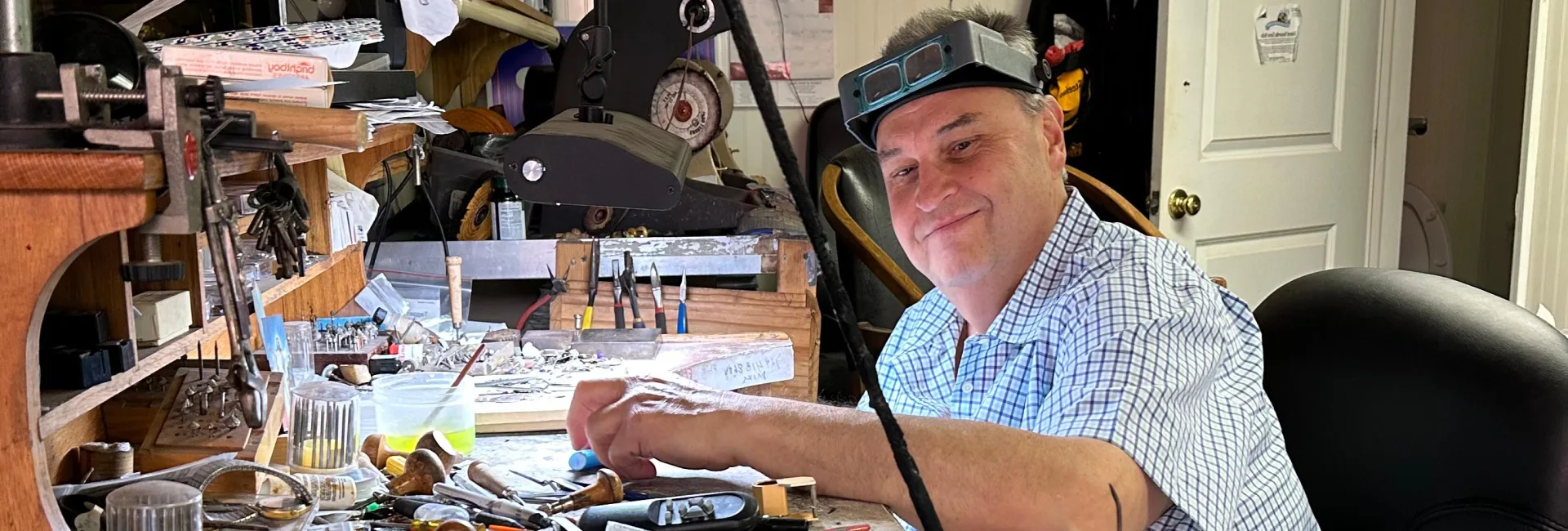 Inside Gold Mind Jewelers Sharon showcasing gold, diamonds, and luxury watches