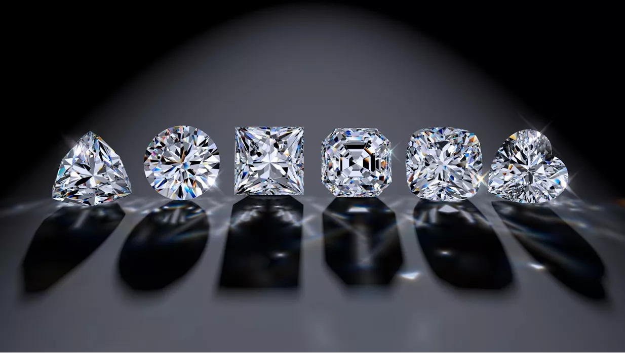 Jewelry expert appraising loose diamonds and diamond rings in Sharon
