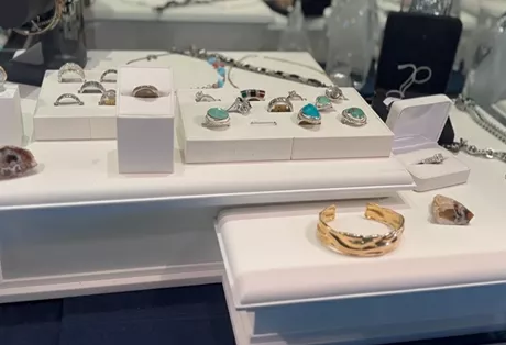 Customer selling gold and diamond jewelry at Gold Mind Jewelers Sharon
