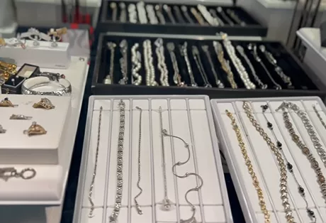 Customer selling gold and diamond jewelry at Gold Mind Jewelers Sharon