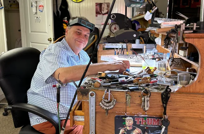 Inside Gold Mind Jewelers Sharon showcasing gold, diamonds, and luxury watches