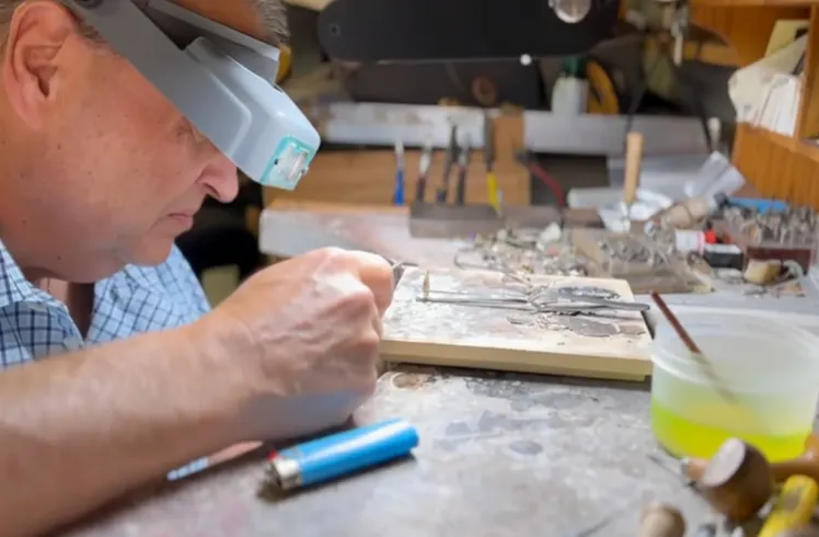 Inside Gold Mind Jewelers Sharon showcasing gold, diamonds, and luxury watches