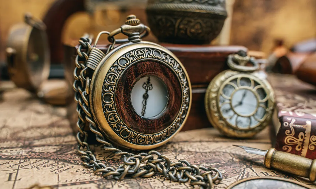 Expert evaluating antique jewelry and collectibles at Gold Mind Jewelers Sharon