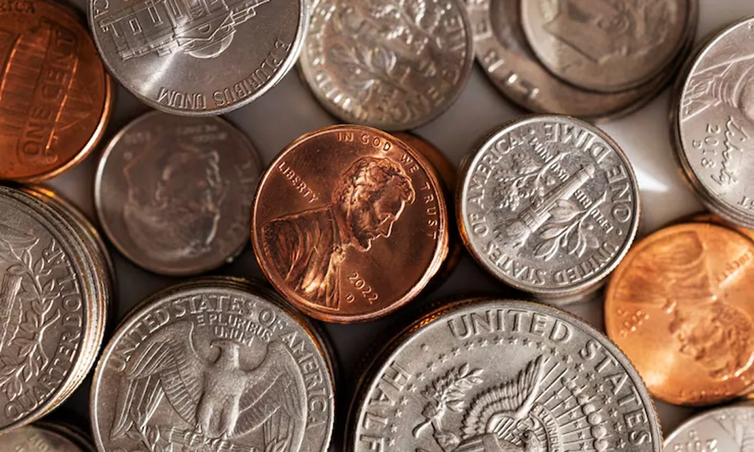 Expert evaluating antique jewelry and collectibles at Gold Mind Jewelers Sharon